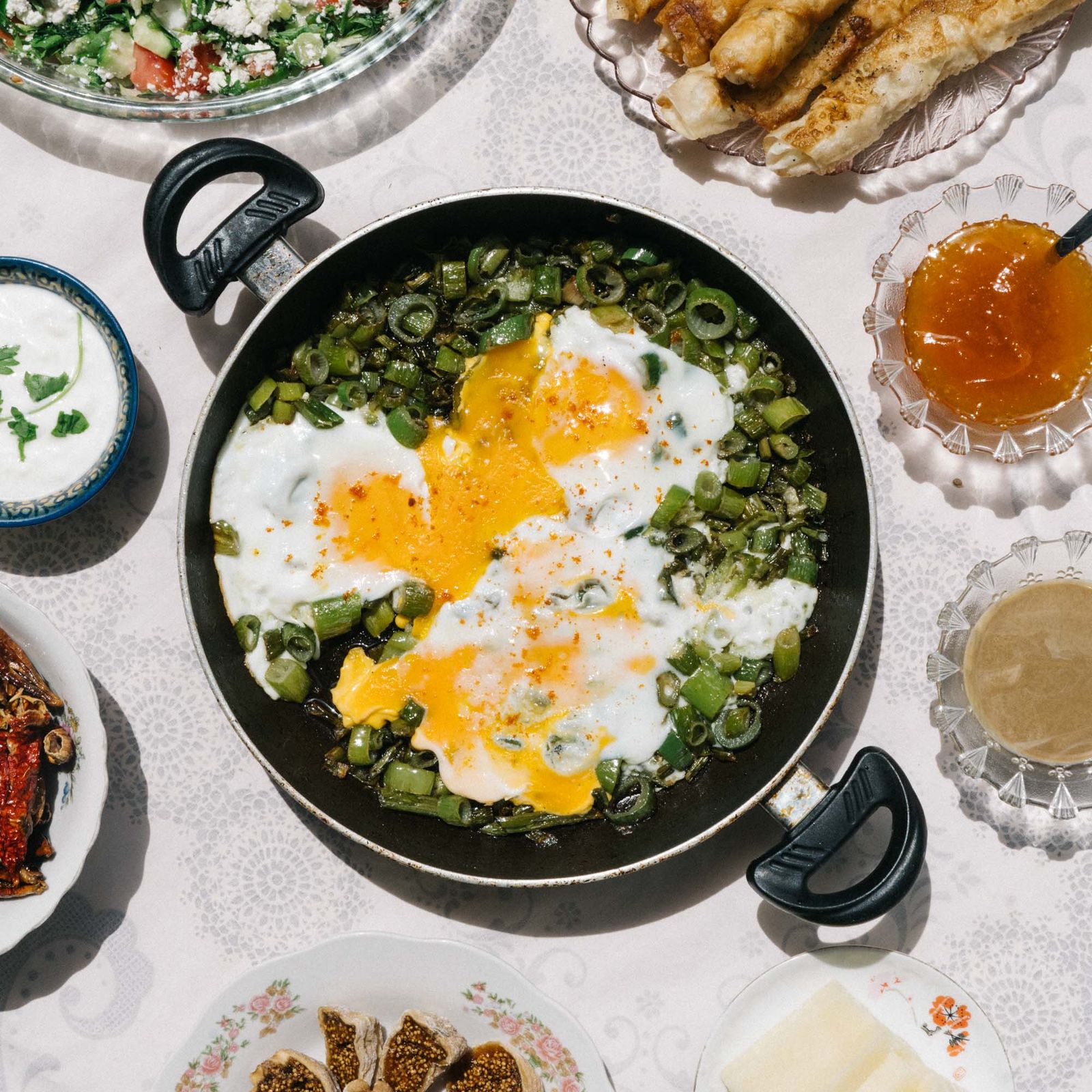 Herby Turkish eggs with wild greens