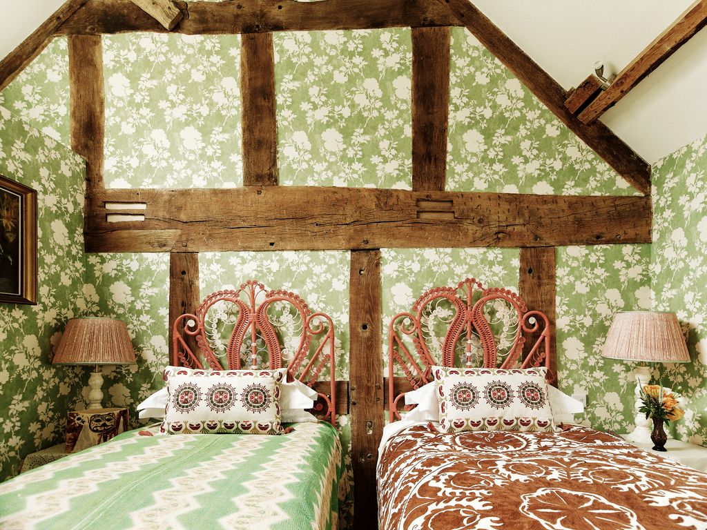 Image may contain Indoors Interior Design Cushion Home Decor Furniture Wood Architecture Building Housing and Bed