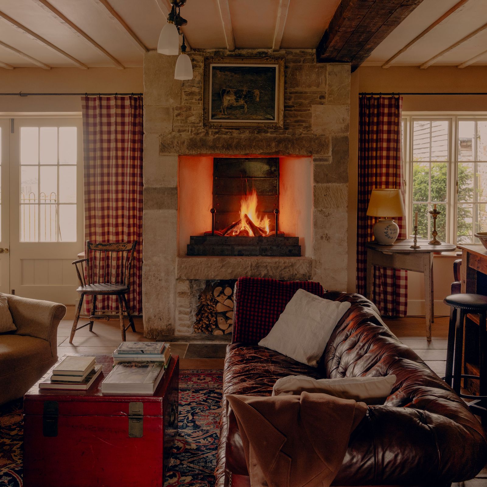 A farmhouse owned by Guy Ritchie imbued with a colonial-American-meets-English-pub aesthetic