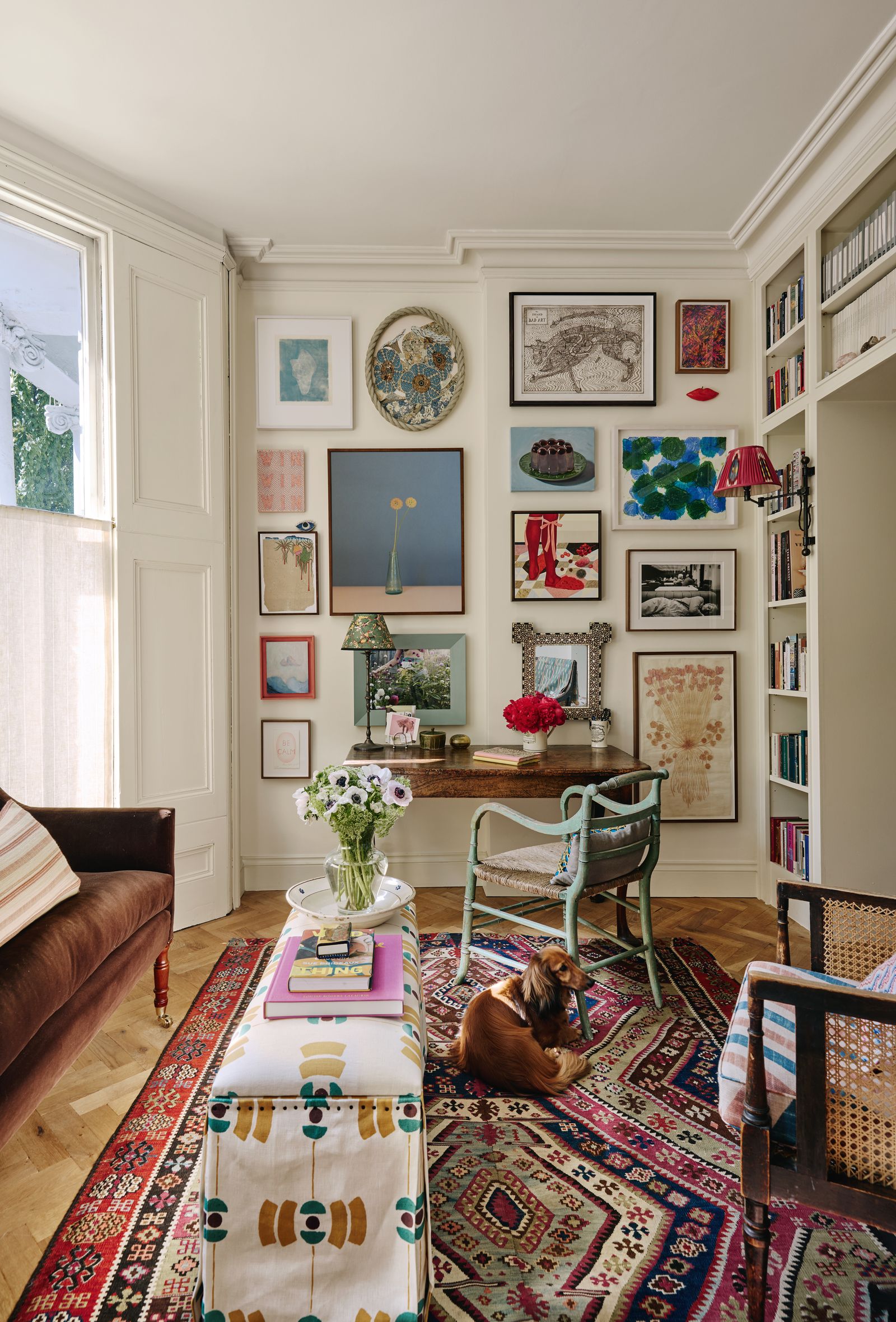 Behind gallerist Lyndsey Ingrams desk a salon wall features works by Grayson Perry Howard Hodgkin and Georgie Hopton...